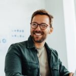Happy,Business,Man,Listening,To,A,Discussion,In,An,Office